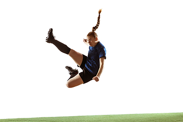 Image showing Female soccer, football player kicking ball, training in action and motion with bright emotions isolated on white background