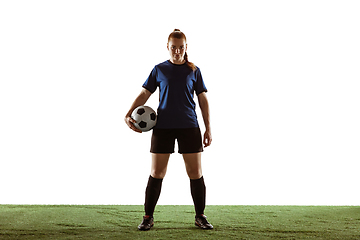 Image showing Female soccer, football player posing confident with ball isolated on white background