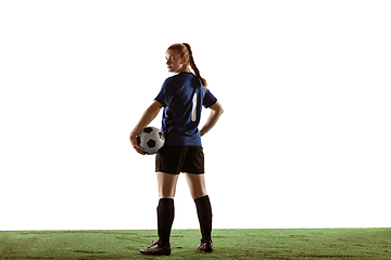 Image showing Female soccer, football player posing confident with ball isolated on white background