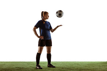 Image showing Female soccer, football player posing confident with ball isolated on white background