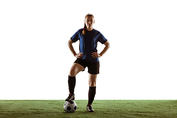 Image showing Female soccer, football player posing confident with ball isolated on white background