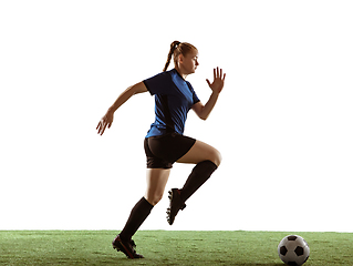 Image showing Female soccer, football player kicking ball, training in action and motion with bright emotions isolated on white background