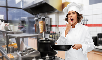 Image showing surprised chef with frying pan at kebab shop