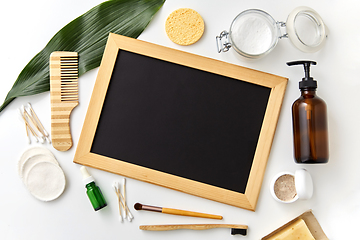 Image showing natural cosmetics and chalkboard