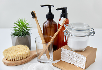 Image showing wooden toothbrush, cotton pads and swabs in box