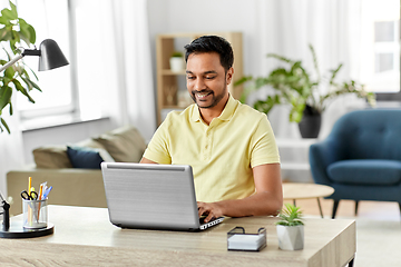 Image showing indian man with laptop working at home office