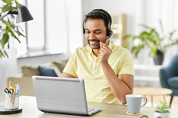 Image showing indian man with headset and laptop working at home