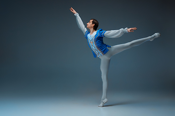 Image showing Young and graceful ballet dancer in action isolated on studio background