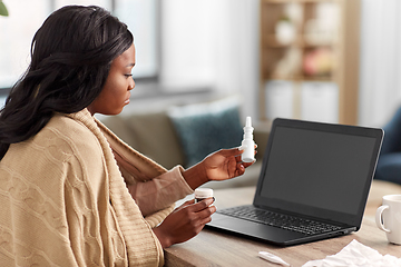 Image showing sick woman having video call on laptop at home