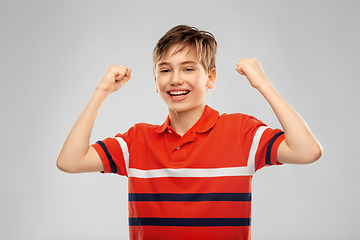 Image showing portrait of happy smiling boy celebrating success