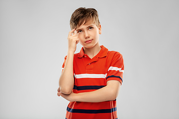 Image showing portrait of thinking boy in red polo t-shirt