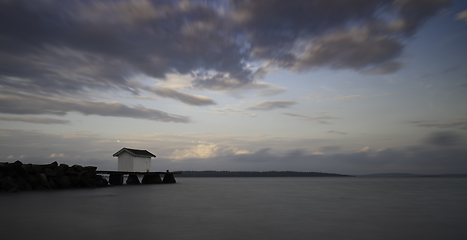 Image showing A small building on a pier