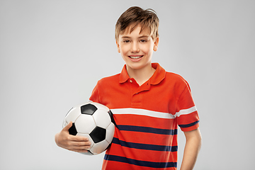 Image showing happy smiling boy holding soccer ball