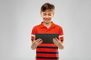 Image showing happy smiling boy using tablet computer