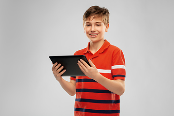 Image showing happy smiling boy using tablet computer