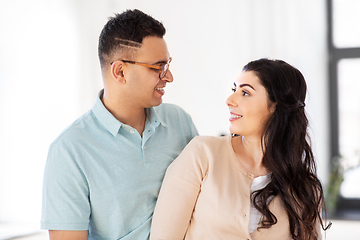 Image showing happy couple looking at each other at home