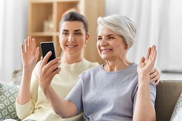 Image showing daughter and old mother having video call on phone