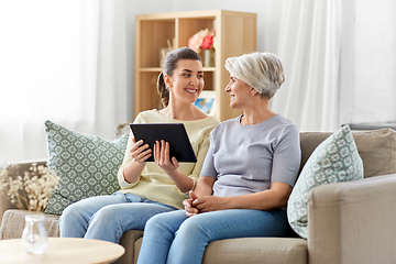 Image showing daughter and senior mother with tablet pc at home