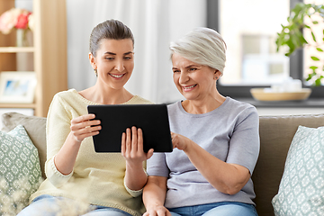 Image showing daughter and senior mother with tablet pc at home