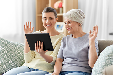 Image showing daughter and mother having video call on tablet pc