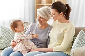 Image showing mother, daughter and grandmother on sofa at home