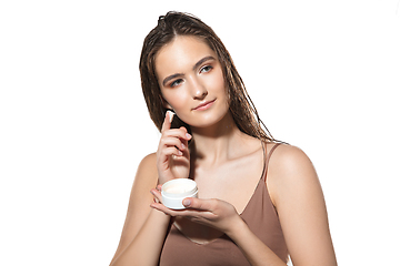 Image showing Close up of beautiful female face with organic treatment over white background. Cosmetics and makeup, natural and eco treatment, skin care.