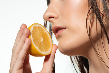 Image showing Close up of beautiful female face with organic treatment over white background. Cosmetics and makeup, natural and eco treatment, skin care.