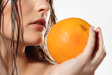 Image showing Close up of beautiful female face with organic treatment over white background. Cosmetics and makeup, natural and eco treatment, skin care.