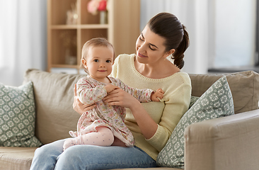 Image showing happy mother with little baby daughter at home