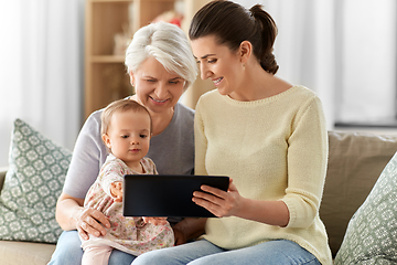 Image showing mother, daughter and grandma with tablet pc