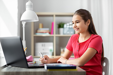 Image showing student girl with laptop computer learning at home