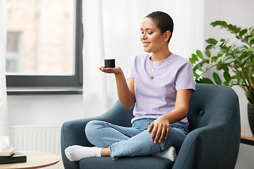 Image showing african american woman with smart speaker at home