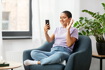 Image showing woman with smartphone having video call at home