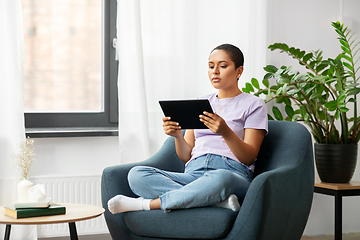 Image showing african american woman with tablet pc at home