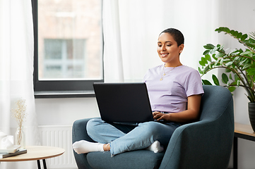 Image showing african american woman with laptop at home