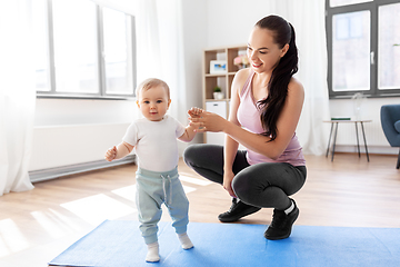 Image showing happy mother with little baby at home