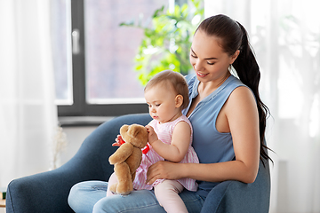 Image showing happy mother with little baby daughter at home