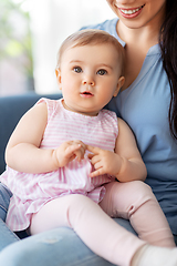 Image showing portrait of little baby girl with happy mother