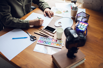 Image showing Close up of man giving online drawing lessons at home. Recording teacher\'s tutorial on camera for kids. Digitalization, remote education