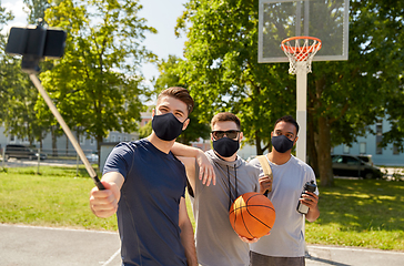 Image showing happy men taking selfie on basketball playground