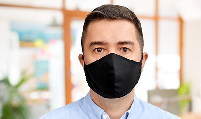 Image showing middle-aged man in reusable face protective mask