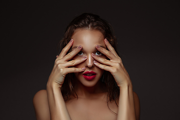 Image showing Portrait of beautiful stylish woman isolated on dark studio background