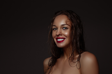 Image showing Portrait of beautiful stylish woman isolated on dark studio background