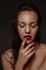 Image showing Portrait of beautiful stylish woman isolated on dark studio background