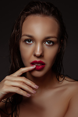 Image showing Portrait of beautiful stylish woman isolated on dark studio background