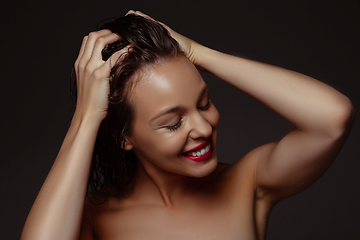 Image showing Portrait of beautiful stylish woman isolated on dark studio background