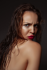 Image showing Portrait of beautiful stylish woman isolated on dark studio background