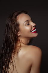 Image showing Portrait of beautiful stylish woman isolated on dark studio background