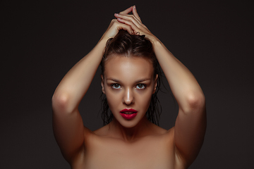 Image showing Portrait of beautiful stylish woman isolated on dark studio background