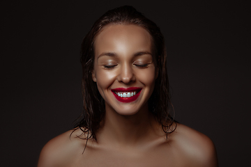 Image showing Portrait of beautiful stylish woman isolated on dark studio background